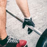 A man about to lift a large weights bar with 40kg on it